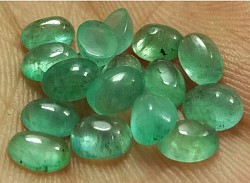 • 8.90 ct Oval Cabochon Emeralds.