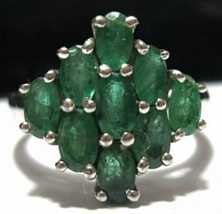 • Selection of three Zambian Emerald rings.