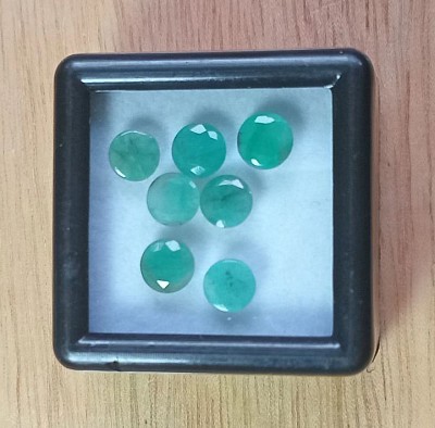 • 3.5 ct Round Faceted Emeralds.